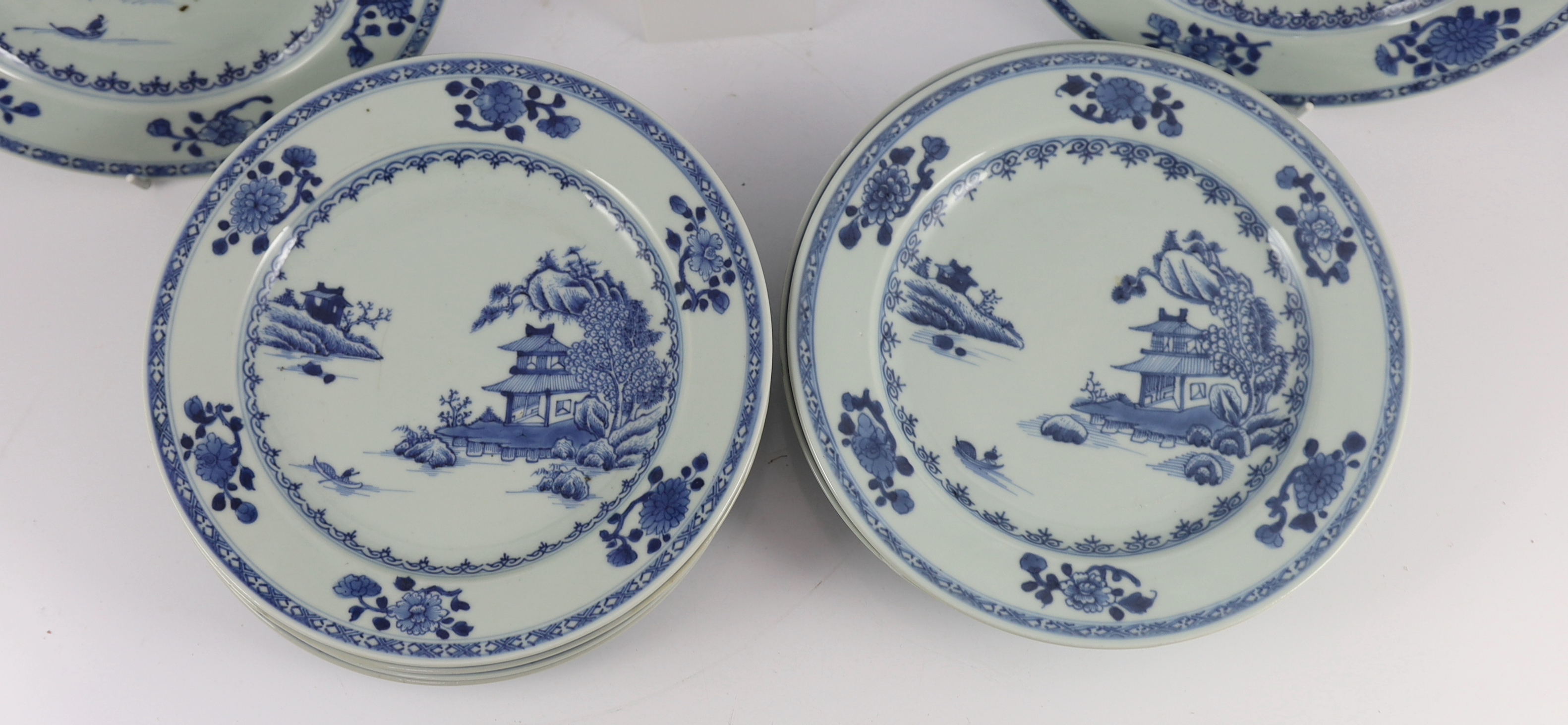 Twelve Chinese blue and white ‘Boatman and Six flower border’ plates, Nanking Cargo, c.1750